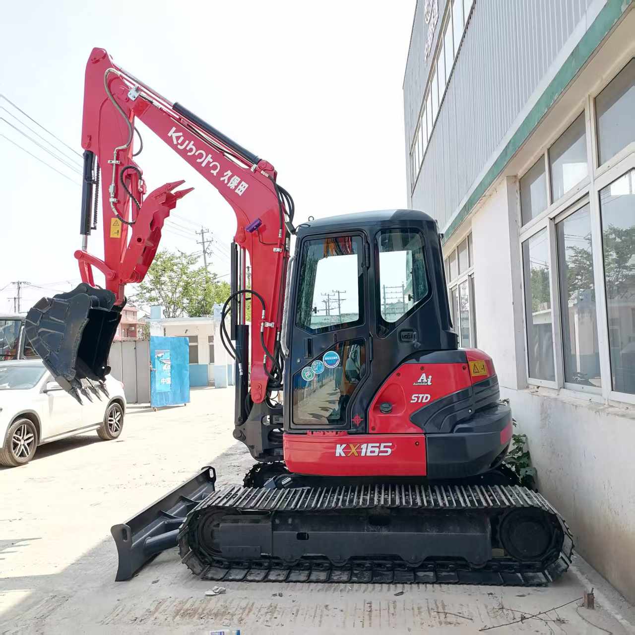 Front and blade view of used 2025 Kubota KX165-5 excavator – certified pre-owned by Richreach